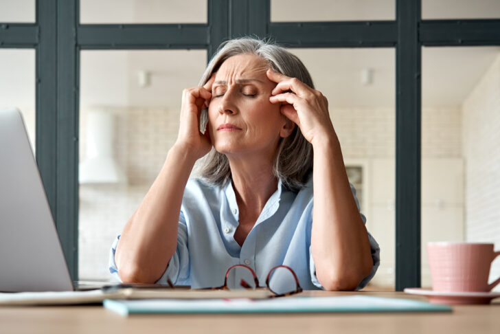 Tired Stressed Old Mature Business Woman Suffering From Headache At